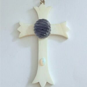 14 k gold Ivory cross with carved tanzanite and opal accent